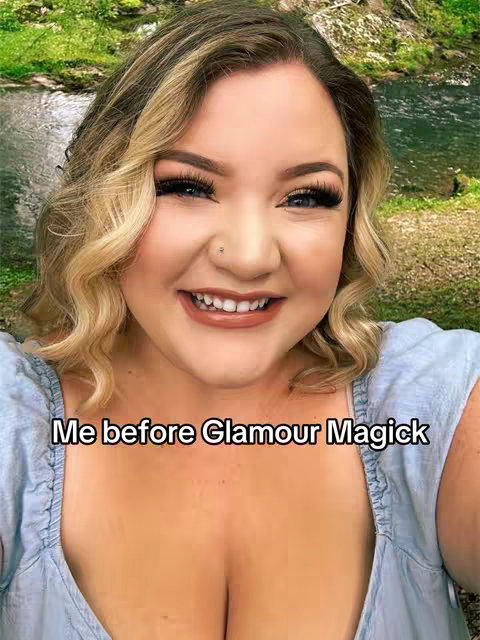 The cover image features a woman with blonde wavy hair smiling at the camera. She has full makeup, including long eyelashes, eyeshadow, and lipstick. The background is a blurred image of a forest with a stream.