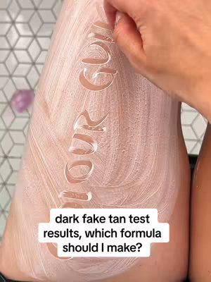 The cover image shows a close-up of a leg covered in white tanning mousse. The word "YOUR GLOW" is written into the mousse with a finger, and the tan is visible in the formed letters. Underneath, white text on a dark rectangle says "dark fake tan test results, which formula should I make?"