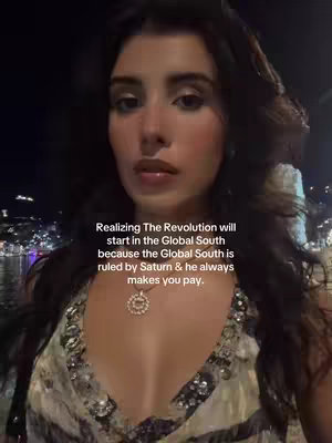 A woman with dark hair and a sparkling top is standing outdoors at night. The text overlay states that the revolution will start in the Global South.