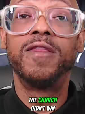 A close-up shot of a man wearing glasses, with overlaid text at the bottom. The man has short black hair, a goatee, and is wearing a black shirt. The text reads 'THE CHURCH DIDN'T WIN' in a green and white font against a black background.