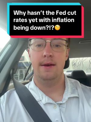 The cover image is a selfie-style shot taken from inside a car. The main subject is a man wearing glasses who appears to be speaking directly to the camera. Above the man's head, there is a text overlay in white font within a rectangular box that looks like it is made up of a combination of blue and red colors. He's seated, facing forward, with the car's interior visible around him, including the windshield and what appears to be a seatbelt. The background, blurred, suggests a daytime setting.