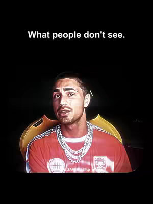 The cover image is a portrait of a man against a dark background. The man is looking directly at the camera. He is wearing a red jersey with white stripes, a white t-shirt underneath, and a thick, silver chain. He has short, dark hair and a beard, and appears to be in his late 20s or early 30s. Above him, in white text, is the phrase 'What people don't see.' Behind him, there is a golden shape that might be a stylized throne.