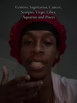 A selfie-style video cover featuring a person indoors, with the upper body in focus. The person is wearing a dark beanie or cap covering their hair and a red bonnet. The individual is looking directly at the camera, with eyes visible and a slightly open mouth. Overlayed text at the top of the frame lists various zodiac signs vertically in white text over a dark background.