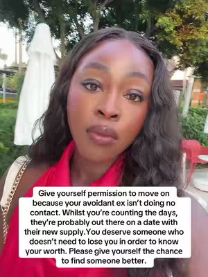 A woman with dark, wavy hair and makeup looks directly at the camera. In the background, there are blurred elements that suggest an outdoor setting. Overlayed with a white rectangular box containing text is about moving on after a breakup.