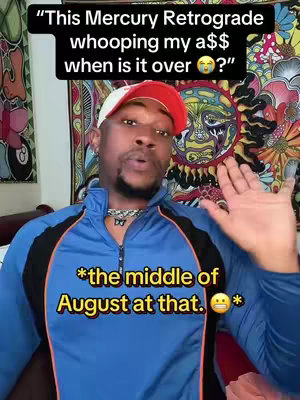 A man with a beard and a red and white baseball cap is centered in a video cover image. He wears a blue and black zip-up jacket and a silver chain. Text is overlaid at the top and bottom of the image in contrasting colors of black and yellow. The background includes a colorful tapestry with what appears to be a sun-like design.