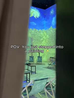 The image shows a room with walls covered in a projection of a Van Gogh painting. A doorway on the left is framed by a tan curtain. Inside the room, chairs and easels are placed in front of the painting. Text overlay at the bottom left corner reads: 'POV: You just stepped into a painting.'