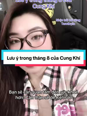 The cover image features a woman with glasses, positioned from the waist up. Text overlays are placed across the top and center, while additional text appears at the bottom. The background is muted, while the woman is the central focus of the image.