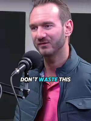 A man with light skin, wearing a blue puffy jacket over a red shirt, is framed from the chest up, speaking into a microphone. The background is blurred and seemingly indoors. The text overlay reads 'DONT WASTE THIS'.
