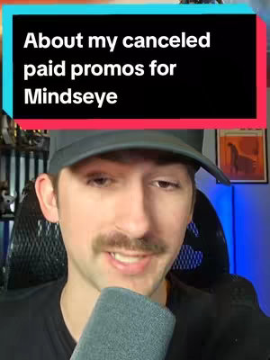 A man with a mustache wearing a black cap and shirt is in front of a microphone. At the top is a black rectangle with white text.
