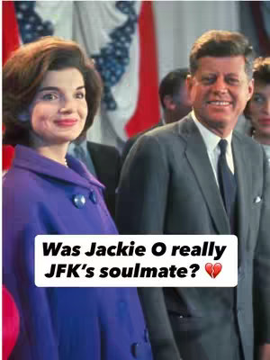 The cover image shows a color photograph of Jackie Kennedy and John F. Kennedy smiling and standing near draped flags. Jackie Kennedy is on the left dressed in a purple coat. John F. Kennedy is on the right in a grey suit. A white rectangle with dark text and a heart emoji overlays the bottom.