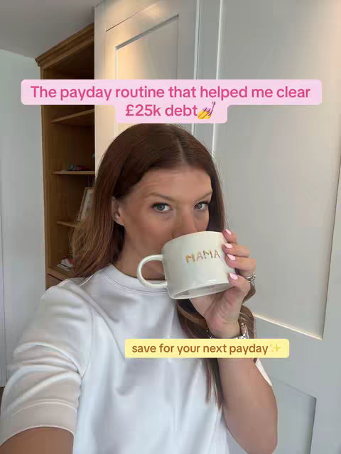 A woman with long brown hair is holding a white mug that says MAMA while drinking. She's wearing a white shirt with a pink text box that says "The payday routine that helped me clear £25k debt" at the top, and yellow text box saying "save for your next payday"