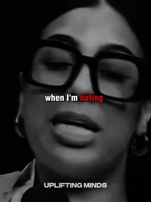 A black and white image of a woman wearing large glasses. The text overlay reads 'when I'm dating' in white with the word 'dating' in red. Underneath, the text 'UPLIFTING MINDS' is visible.