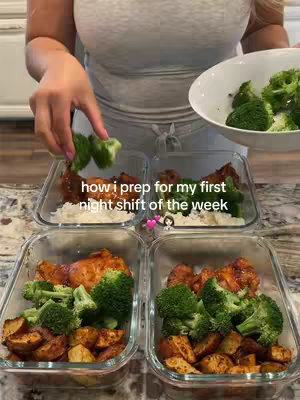 A person in a light grey t-shirt is shown meal prepping with a variety of cooked foods in clear containers. She is adding broccoli to the containers. Text overlay stating "how i prep for my first night shift of the week".