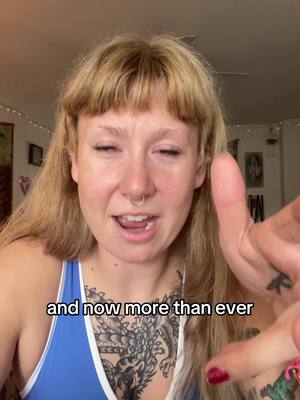 A woman with blonde hair and a nose ring looks at the camera. Text that reads 'and now more than ever' is at the bottom.