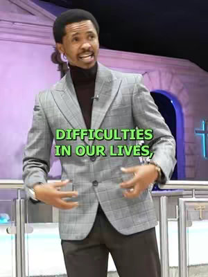 The cover image features a man gesturing while speaking. He's wearing a gray plaid blazer over a dark turtleneck. Text overlayed in the middle of the frame states, "DIFFICULTIES IN OUR LIVES," in a green box. The background is slightly blurred, showing what looks like a building facade with a cross.