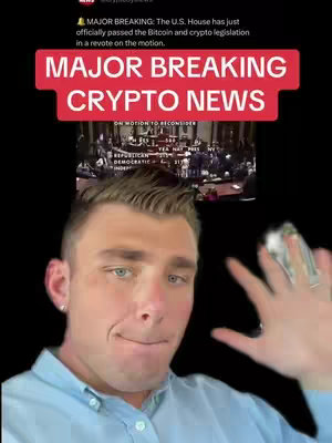 A man with fair skin and short, light brown hair is centered in front of a black background. Over him is a red banner with the words "MAJOR BREAKING CRYPTO NEWS" in white. The background behind the banner displays a news feed with text and a screenshot of a legislative session in progress. The man is wearing a light blue button-down shirt, and extends his hand near his face. The man's face conveys a mix of surprise, excitement, and seriousness.