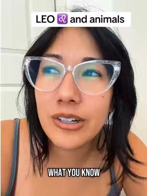 A woman with dark hair and glasses is centered in the frame, with text overlays. The top text says 'LEO ♌ and animals,' while the bottom text says 'WHAT YOU KNOW'. The woman is looking toward the viewer, with a neutral expression, possibly speaking.