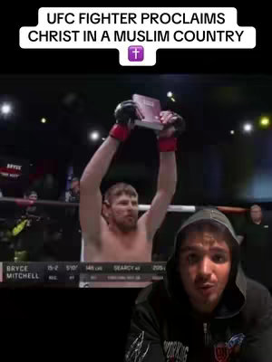 The image shows a split screen with a close-up of a man's face in the bottom right corner and an action shot of a UFC fighter in the top center, holding a book above his head. Text overlays state, "UFC FIGHTER PROCLAIMS CHRIST IN A MUSLIM COUNTRY." and the plus sign.
