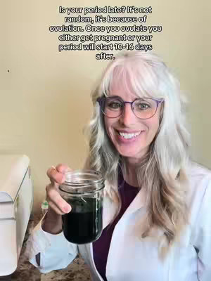 A woman in a white lab coat and glasses is smiling while holding up a jar containing a dark green liquid. Text overlays are present in the upper part of the image.