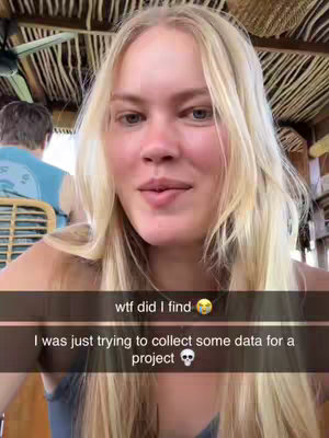 The cover image features a young woman with long blonde hair, fair skin, and blue eyes, positioned indoors with a partially visible ceiling made of straw or similar material. She is wearing a casual top. The background includes a glimpse of another person in a blue shirt and some wooden structures. Text overlays are present at the bottom of the image.