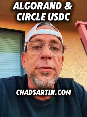 A man wearing glasses and a white baseball cap is centered in the shot, with text overlays at the top and bottom. The background is slightly out of focus, featuring a glimpse of a building exterior. The man has a mature appearance.