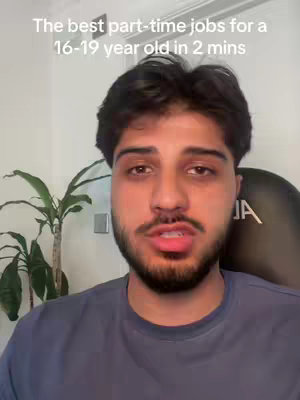 A medium shot features a young man with dark hair and a beard, looking directly at the camera. Above him, a text overlay reads, 'The best part-time jobs for a 16-19 year old in 2 mins'. The background shows a bright wall, a potted plant, and a black chair. The overall composition suggests a straightforward, informational video.