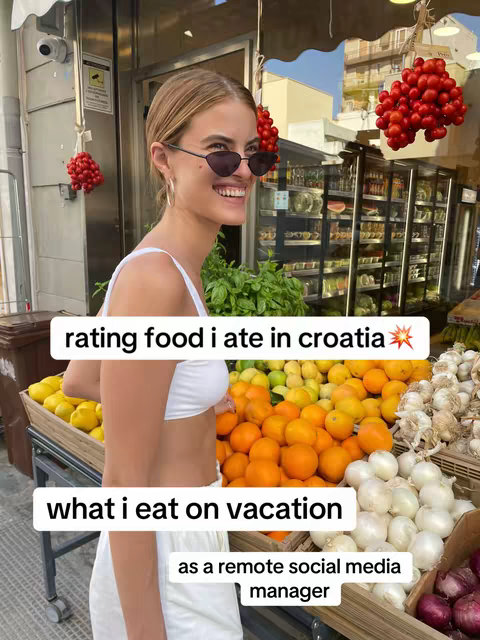 A woman with sunglasses smiles in front of a fruit and vegetable stand, with text overlays indicating a food review on vacation.