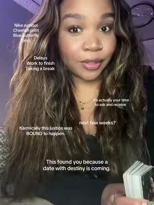 A medium shot of a woman facing the camera, with long, wavy dark hair and wearing a black top. Overlay text is added on the image in white font.
