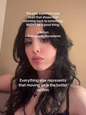 A selfie-style image featuring a woman with long, dark hair. The background is a plain, light-colored wall. Text overlays are present, with one portion mentioning Saturn and retrograde placements related to astrology.