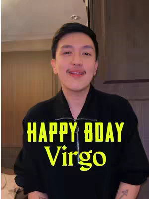 A man with short, dark hair and a mustache is smiling at the camera. He is wearing a black zippered jacket. Overlayed on the image are the words "HAPPY BDAY Virgo" in a yellow, stylized font.