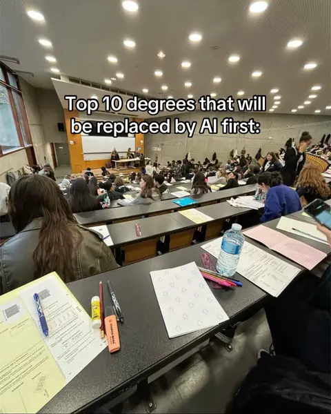The cover image shows a large lecture hall filled with students. It's a wide shot with rows of desks and people. A text overlay says 'Top 10 degrees that will be replaced by AI first:'. The overall composition focuses on the classroom setting and the number of students in attendance.