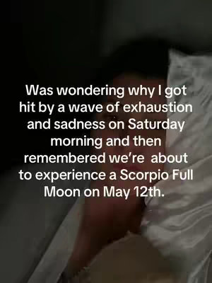 A person is lying in bed with a white pillow and light-colored sheets. Text is overlaid on the image, discussing the upcoming Scorpio Full Moon.