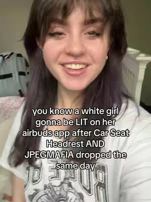 A selfie-style shot featuring a young woman with dark hair and a nose ring, smiling at the camera. Text overlays the image, written in a white, sans-serif font, and contains information about the video's subject matter.
