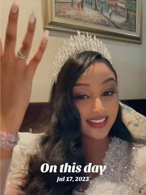A woman in a wedding dress and tiara is posing for a photo. The background includes a framed painting. Text overlayed reads 'On this day' and the date 'Jul 17, 2023.'