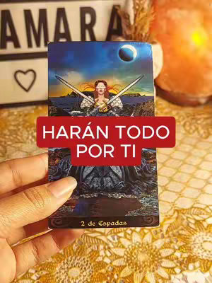 The cover image displays a woman's hand holding a tarot card, '2 de Espadas,' overlaid with the text 'HARÁN TODO POR TI' (They will do everything for you) in a red banner. The background suggests a mystical scene with celestial elements such as the moon and stars, enhancing the tarot theme.