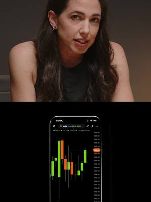 The cover image shows a woman looking at the camera, with a phone displaying a stock chart in the foreground. The woman is in the upper portion, her upper body visible, with long dark hair and wearing a dark top. The phone screen dominated the lower section is displaying what appears to be a stock trading interface, with green and red bars. The background is dark, creating contrast with the figure and the phone screen.