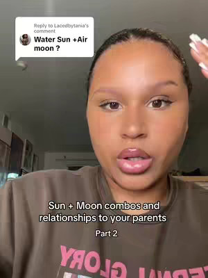 A selfie-style video cover featuring a woman centered in the frame, with slightly blurred background elements suggesting an indoor setting. She has a warm complexion, dark hair pulled back, and is wearing a brown top. Text overlay indicates the topic is about astrology.