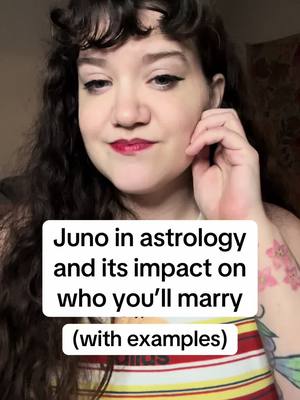 A woman with curly dark hair and red lipstick gazes slightly downward, her hand touching her cheek. A text overlay displays the video topic.