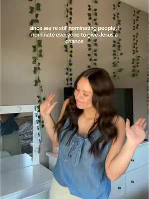 A woman with long brown hair is standing in front of a white dresser and mirror, with vines hanging from the ceiling. The hook text is overlayed on the image.