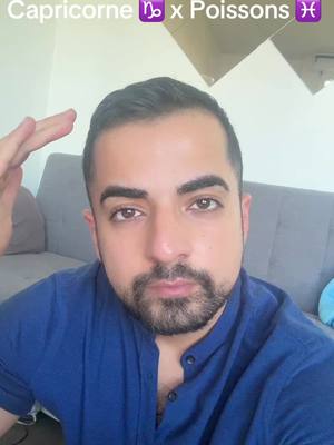 The cover image features a man with short, dark hair and a beard, positioned in a selfie-style shot against an interior background. The man is wearing a blue shirt. Above him in the image is the text 'Capricorne x Poissons' with zodiac symbols. The background includes a gray couch and a mirror.