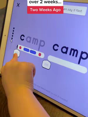 A hand is pointing at an iPad screen showing a word-reading app. The screen displays the word "camp", broken down into its letters with interactive elements for each letter. Additional text overlayed at the top says "over 2 weeks" and "Two Weeks Ago".