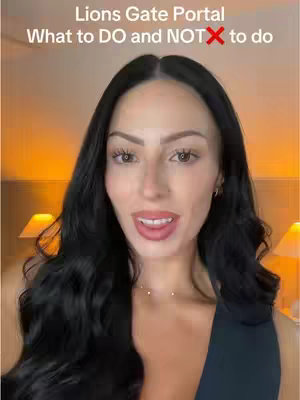 A woman with long, dark hair and a neutral expression is centered in the frame. Text overlays at the top read "Lions Gate Portal" and "What to DO and NOT to do". The background is a warm, blurred interior with soft lighting.
