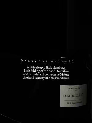A dark, minimalist image with a black background. Centered text in white font quotes Proverbs 6:10-11. A partially visible bottle of 'Mahogany' home fragrance is in the bottom right.