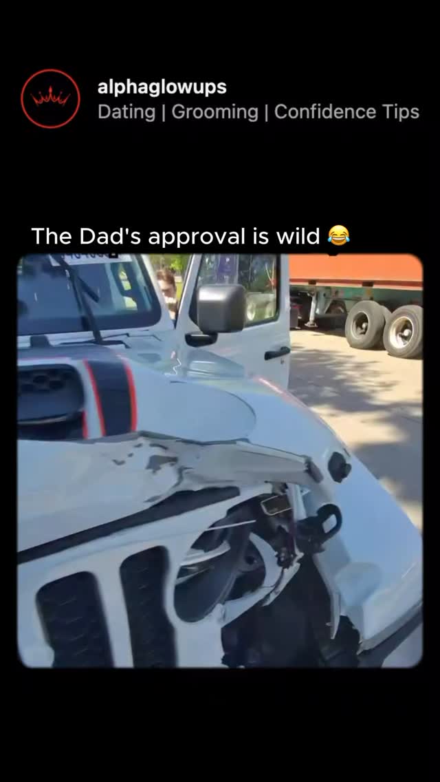 A damaged white Jeep with black racing stripes is the central focus. The front end is severely dented. An open door reveals a person. Additionally, a logo and text overlay are visible at the top-left.