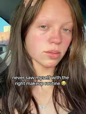 The cover image shows a close-up of a young woman's face. She has long, wavy brown hair. The background appears to be inside a vehicle. The overlay text reads 'never saw myself with the right makeup routine.'