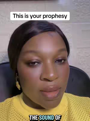 A close-up shot of a person looking directly at the camera. Above the person's head, a text overlay reads \"This is your prophesy\". The person has dark hair, brown eyes, and is wearing a yellow shirt.