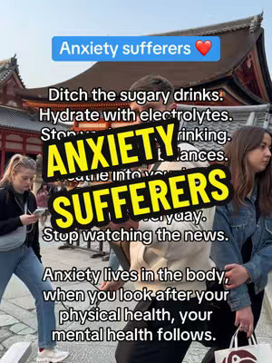 The cover image is a selfie-style shot featuring a person standing in front of a blurred background, possibly a temple of Japan with people. A dark, rectangular text overlay with a black outline features the words 'ANXIETY SUFFERERS' in large, bold, and yellow-filled letters. The text 'Anxiety sufferers' is written in white letters on a blue rounded rectangle. Below are several lines of text in a smaller font.