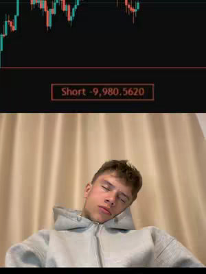 The cover image features a young man with short brown hair wearing a light gray hoodie, leaning his head back against a light beige curtain. The background displays a stock chart and a trading indicator showing a short position with a significant loss.