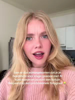 A young woman with long blonde hair is captured in a close-up, expressing surprise and concern. Her mouth is open, and her eyes express the emotion. The setting appears to be indoors, possibly a home or residence. The background is blurred, emphasizing the woman. The overall composition is a selfie-style shot.