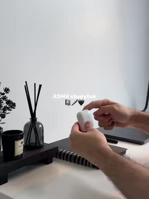 The cover image showcases a minimalist study setup against a white backdrop. A sleek, black organizer with black accessories sits atop the desk, next to what appears to be a notebook with a spiral binding. In the foreground, hands holding a white wireless earbud case are visible. Above, centered text overlays in the form of the video title is displayed.
